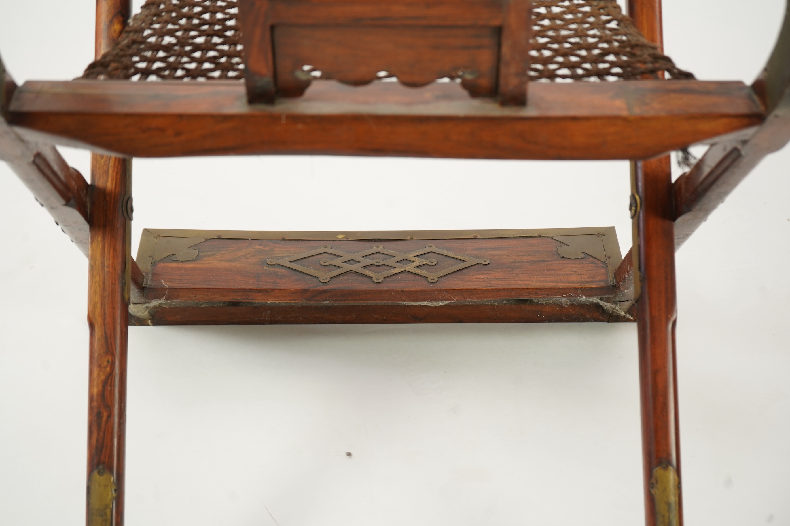A Chinese huanghuali, hongmu and brass mounted folding hunting chair, jiaoyi, early 20th century